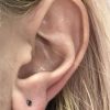 Black diamond stud earring piercing