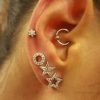 Diamond star earring piercing