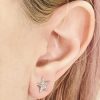 Diamond star earring piercing