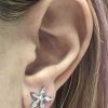 Diamonds flower earring piercing